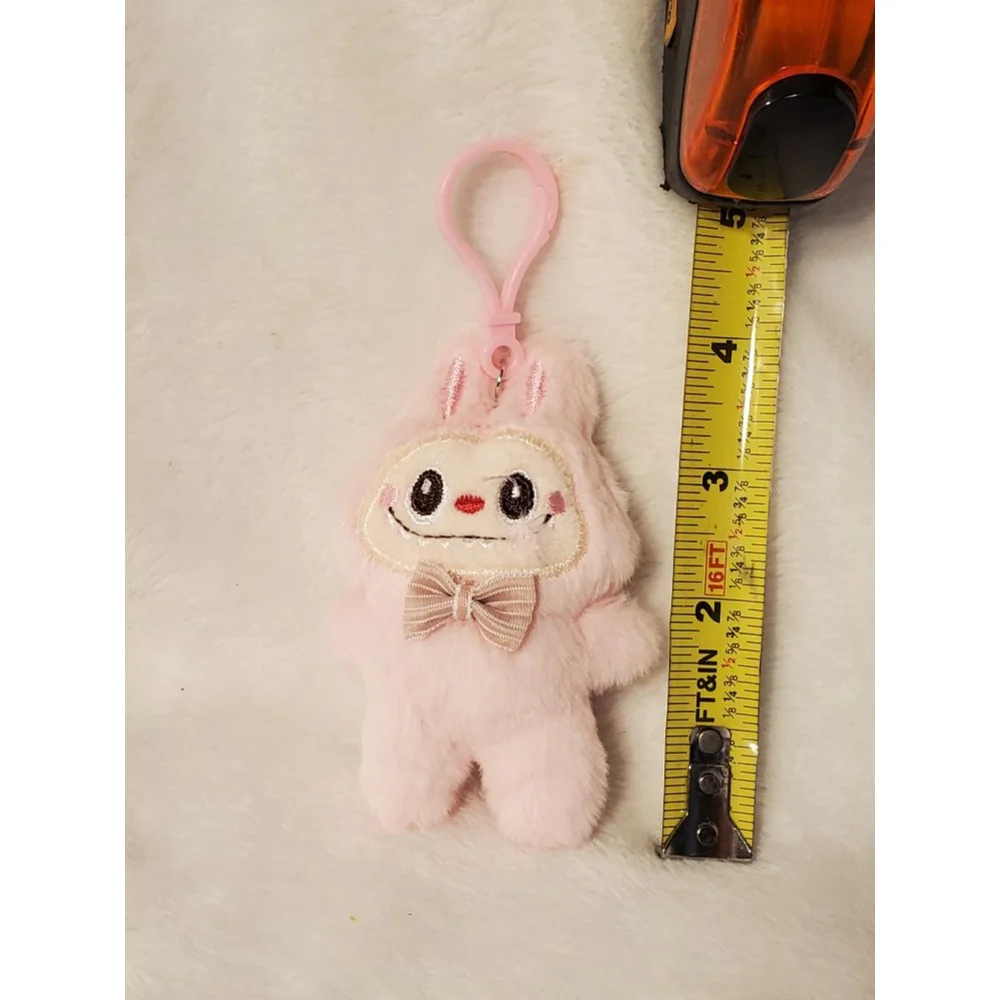 Pink Labubu stuffed keychain featuring a stylish bow tie.